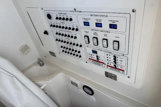  Yacht Photos Pics Electrical control panel on 2022 Edgewater 280CC boat, showing battery status and switches.