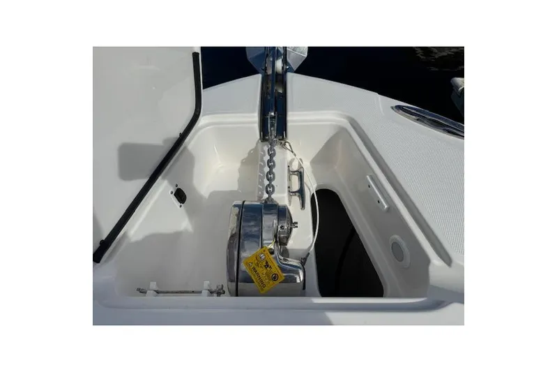  Yacht Photos Pics Anchor compartment of 2022 Edgewater 280CC boat, featuring a stainless steel windlass.