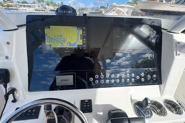  Yacht Photos Pics Edgewater 280CC 2022 boat dashboard with navigation screens and controls.
