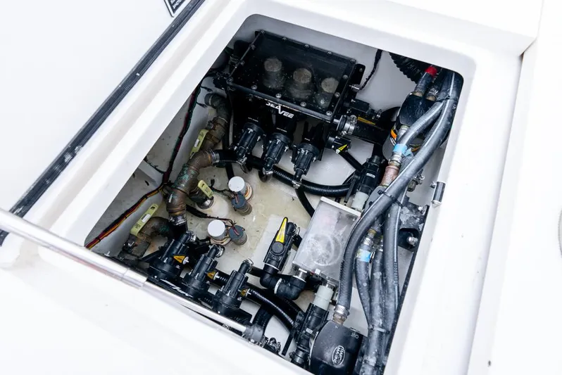  Yacht Photos Pics 2024 SeaVee 450z engine compartment showcasing intricate mechanical components and wiring.