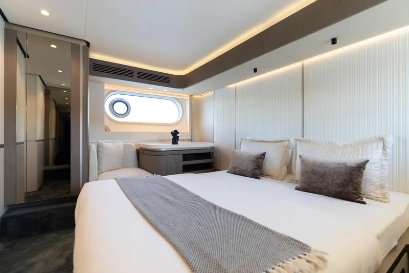 Olivia Yacht Photos Pics Luxurious bedroom interior of 2025 Azimut Magellano 60 yacht with modern design and elegant decor.