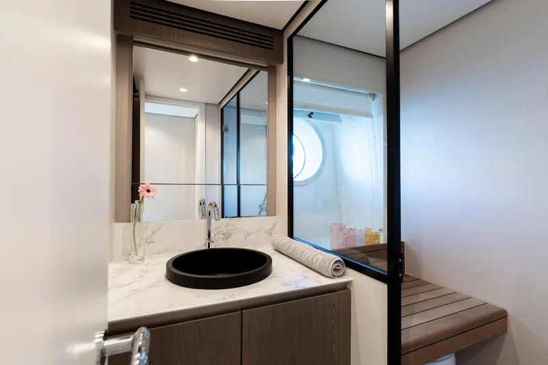 Olivia Yacht Photos Pics Luxurious bathroom interior of 2025 Azimut Magellano 60 yacht with modern fixtures.