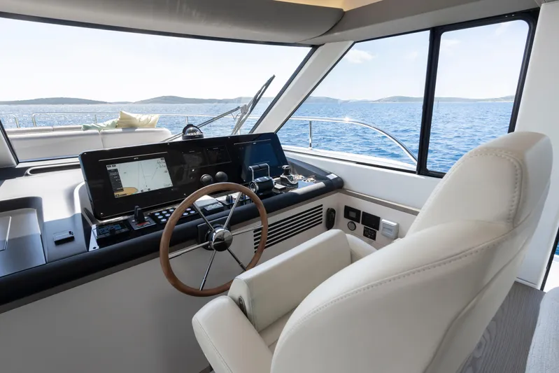 Olivia Yacht Photos Pics 2025 Azimut Magellano 60 yacht helm with modern navigation system and ocean view.