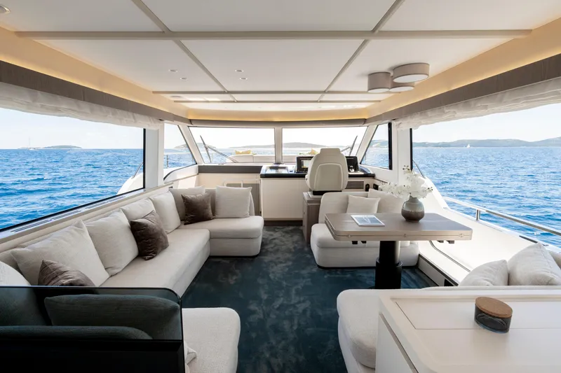 Olivia Yacht Photos Pics Luxurious interior of 2025 Azimut Magellano 60 yacht with ocean view.