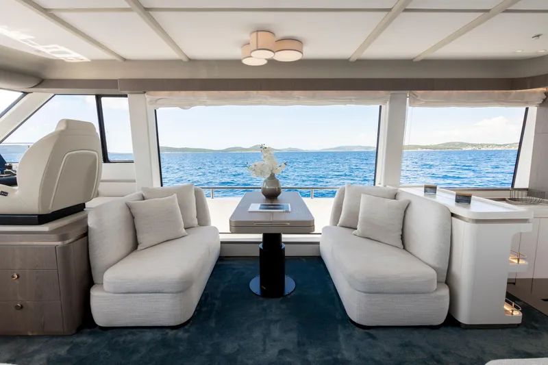 Olivia Yacht Photos Pics Luxurious interior of 2025 Azimut Magellano 60 yacht with ocean view.