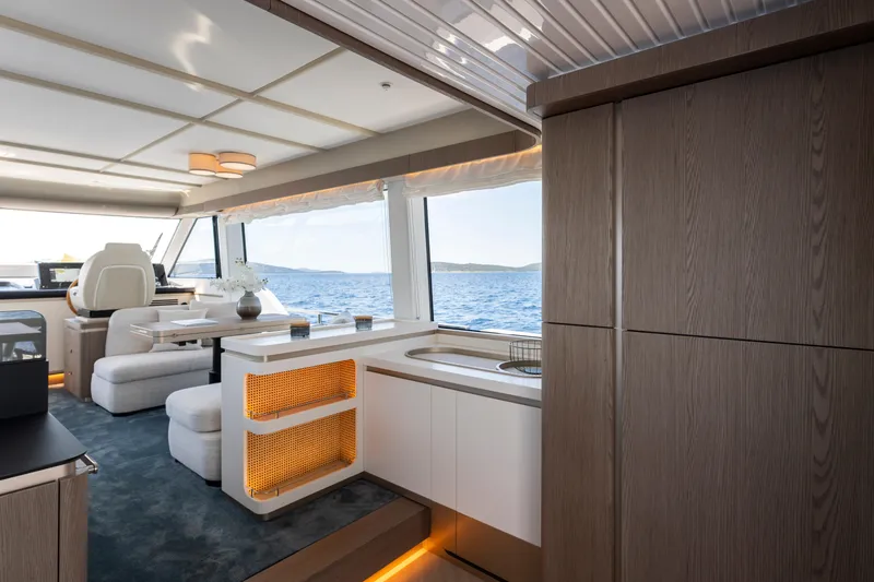 Olivia Yacht Photos Pics Luxurious interior of 2025 Azimut Magellano 60 yacht with ocean view.