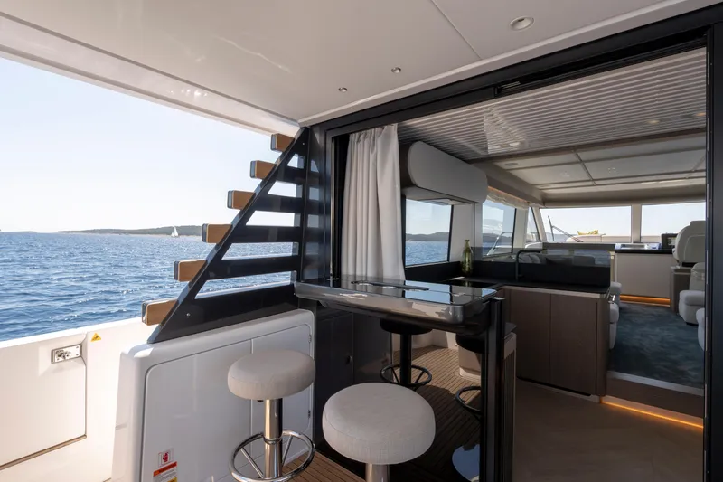 Olivia Yacht Photos Pics Luxurious interior of 2025 Azimut Magellano 60 yacht with ocean view and modern design.