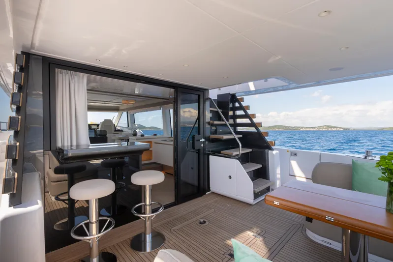 Olivia Yacht Photos Pics Luxurious 2025 Azimut Magellano 60 yacht interior with modern seating and ocean view.