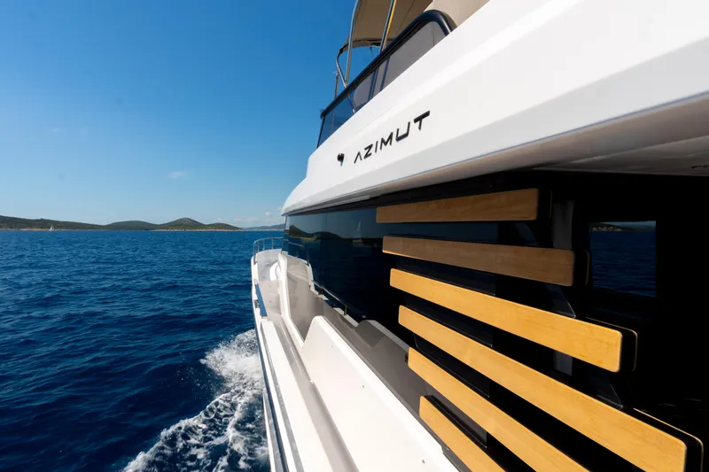 Olivia Yacht Photos Pics Azimut Magellano 60 yacht cruising on blue ocean, 2025 model.
