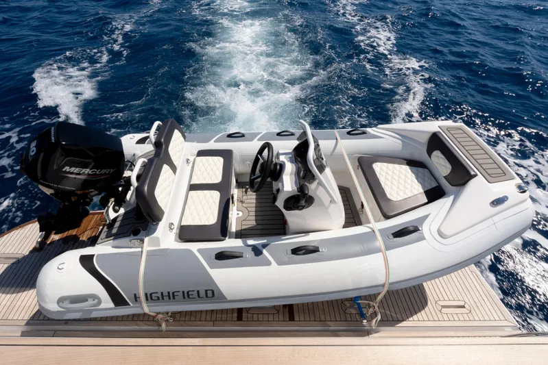 Olivia Yacht Photos Pics 2025 Azimut Magellano 60 with Highfield tender on deck, cruising on open sea.