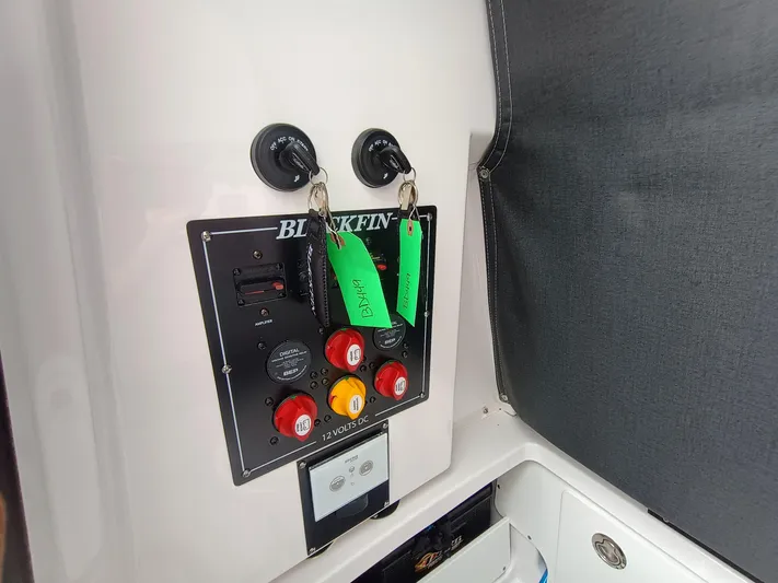  Yacht Photos Pics Control panel of 2025 Blackfin 252 CC boat with labeled switches and keys.