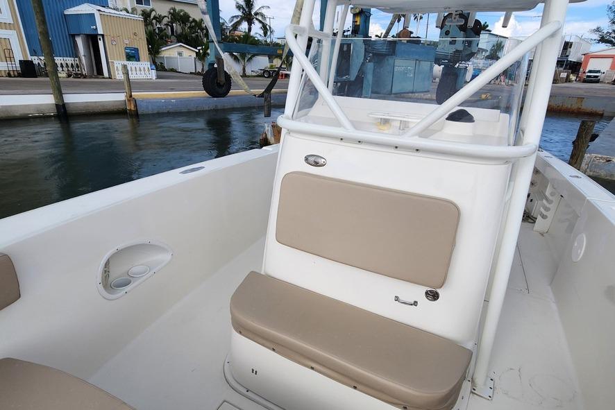 2017 Stamas 308 Predator boat interior with beige seating, dockside view.