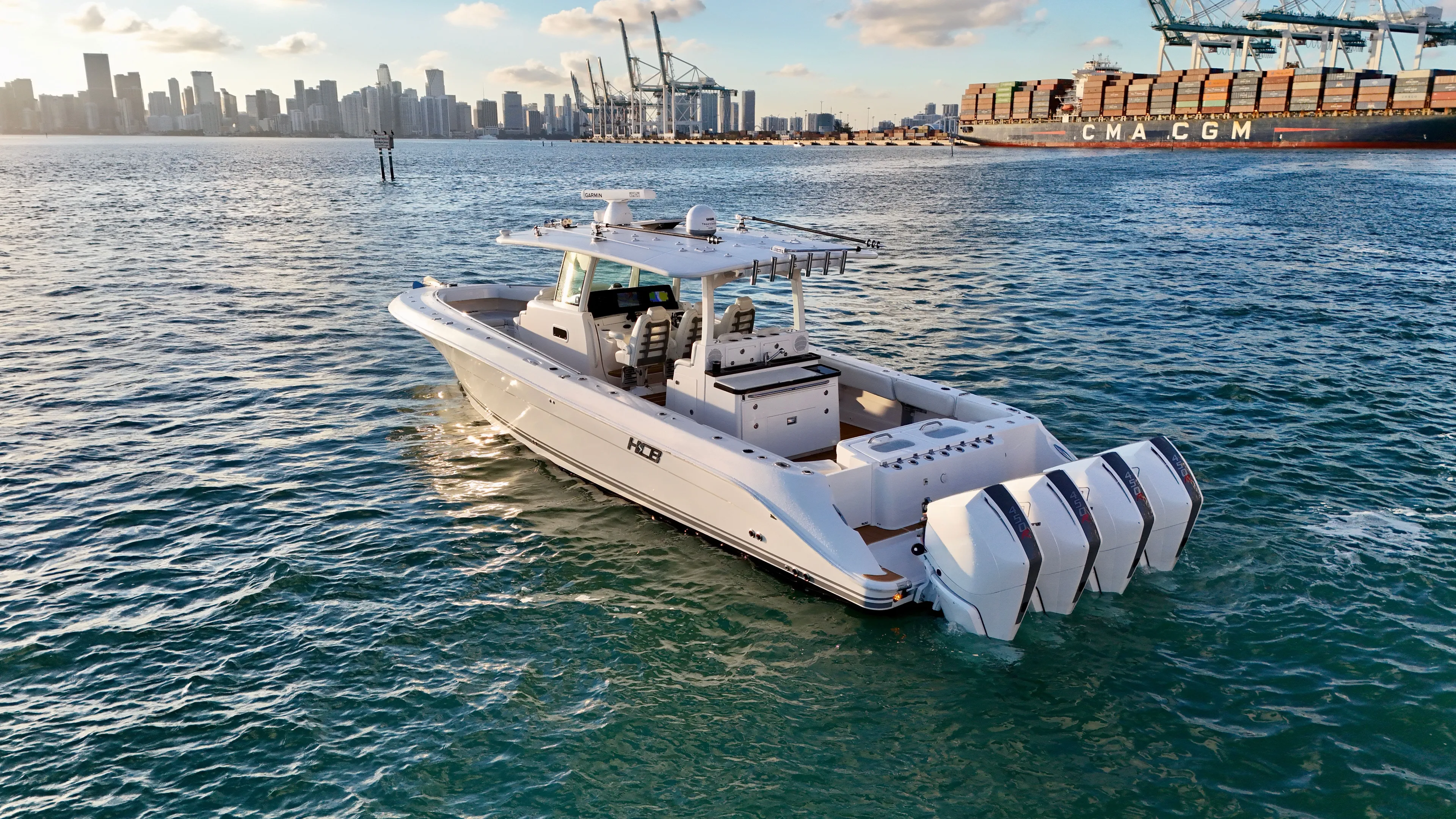  Yacht Photos Pics Luxury HCB Lujo 2021 yacht on water with city skyline.