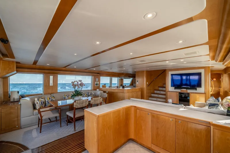Destination Yacht Photos Pics Luxurious interior of a 2007 MCP Tri-Deck yacht with elegant wood finishes and ocean view.