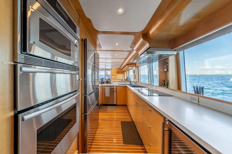 Destination Yacht Photos Pics Luxurious kitchen interior on 2007 MCP Tri-Deck yacht with ocean view.