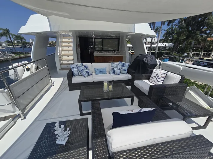 Destination Yacht Photos Pics Luxurious 2007 MCP Tri-Deck yacht with elegant outdoor seating and modern design.