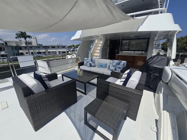 Destination Yacht Photos Pics Luxurious 2007 MCP Tri-Deck yacht with elegant outdoor seating and modern amenities.