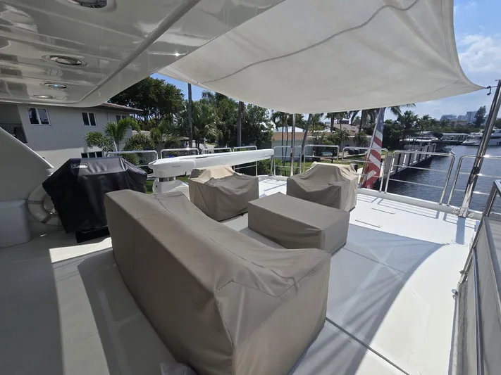 Destination Yacht Photos Pics Luxury yacht deck with covered seating, featuring MCP Tri-Deck 2007 model.