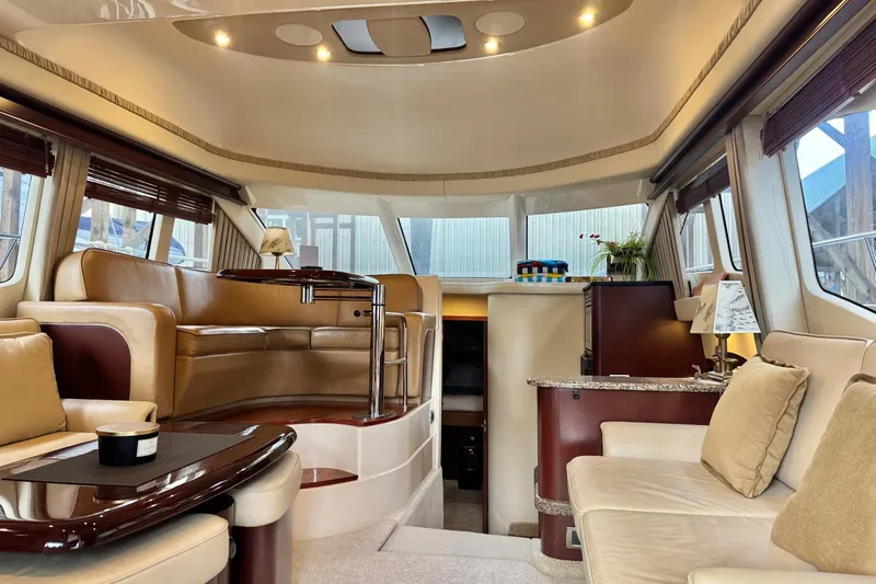 Barefoot Bliss Yacht Photos Pics Luxurious interior of a 2007 Sea Ray 44 Sedan Bridge yacht with elegant seating and decor.