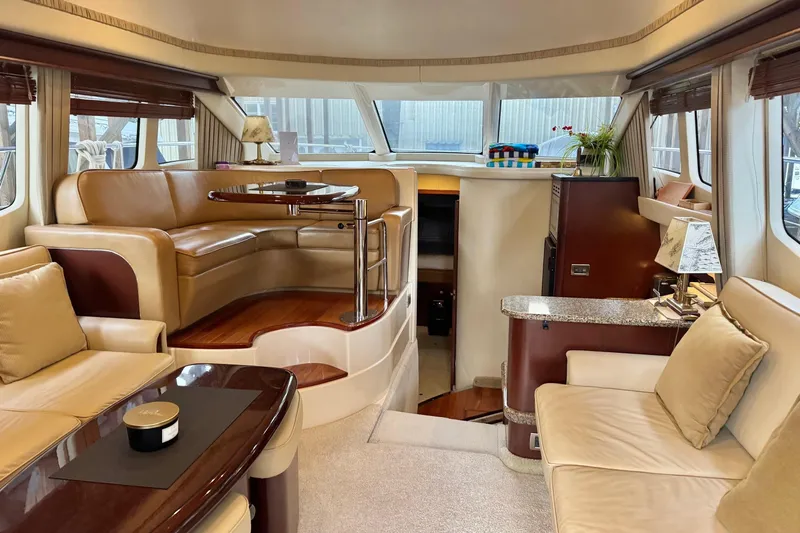 Barefoot Bliss Yacht Photos Pics Luxurious interior of 2007 Sea Ray 44 Sedan Bridge yacht with elegant seating and decor.