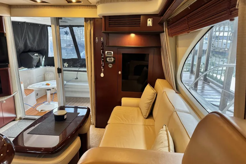 Barefoot Bliss Yacht Photos Pics Luxurious interior of 2007 Sea Ray 44 Sedan Bridge yacht with elegant seating and modern amenities.
