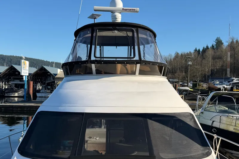 Barefoot Bliss Yacht Photos Pics 2007 Sea Ray 44 Sedan Bridge yacht docked at marina, front view.