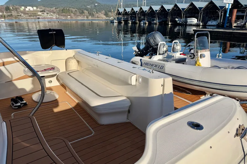 Barefoot Bliss Yacht Photos Pics 2007 Sea Ray 44 Sedan Bridge yacht with spacious deck and scenic marina view.