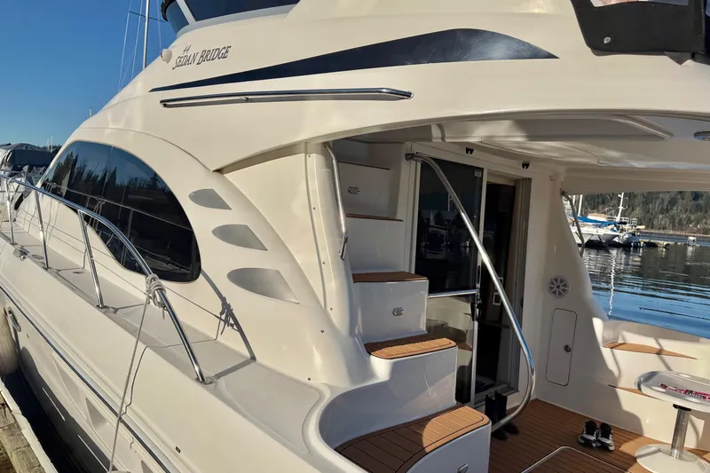 Barefoot Bliss Yacht Photos Pics 2007 Sea Ray 44 Sedan Bridge yacht docked, featuring elegant design and spacious deck area.