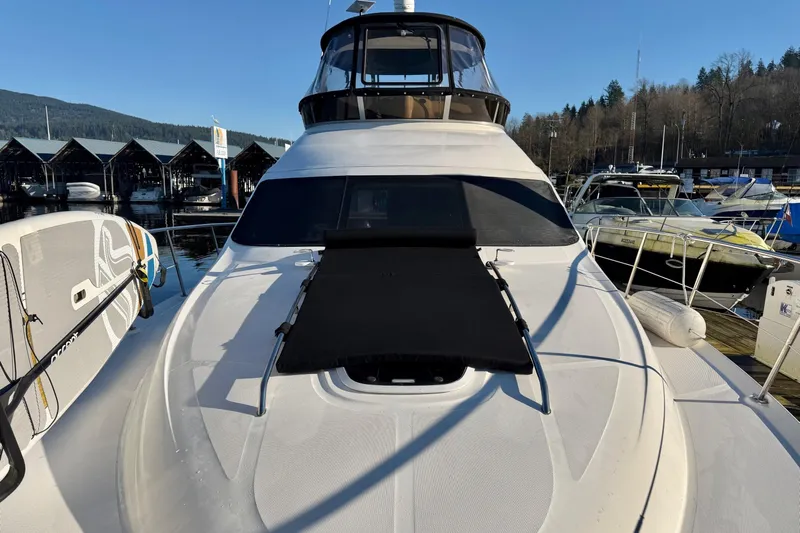 Barefoot Bliss Yacht Photos Pics 2007 Sea Ray 44 Sedan Bridge yacht docked at marina, sunny day.