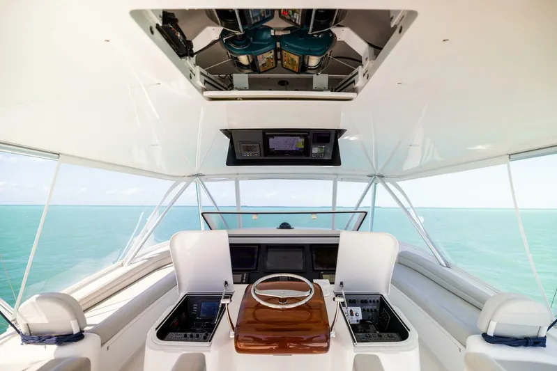 Mighty Mouse Yacht Photos Pics Interior view of 2011 Viking 70 Convertible yacht helm with ocean backdrop.