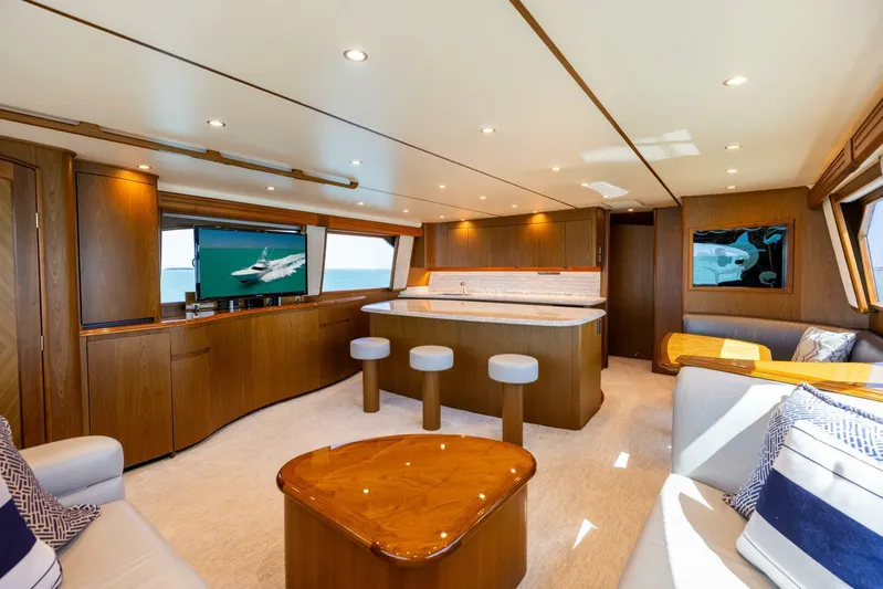 Mighty Mouse Yacht Photos Pics Luxurious interior of 2011 Viking 70 Convertible yacht with elegant wood finishes and modern seating.