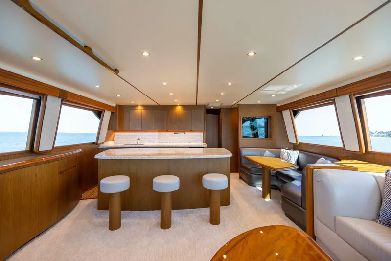 Mighty Mouse Yacht Photos Pics Luxurious interior of 2011 Viking 70 Convertible yacht with modern seating and ocean views.