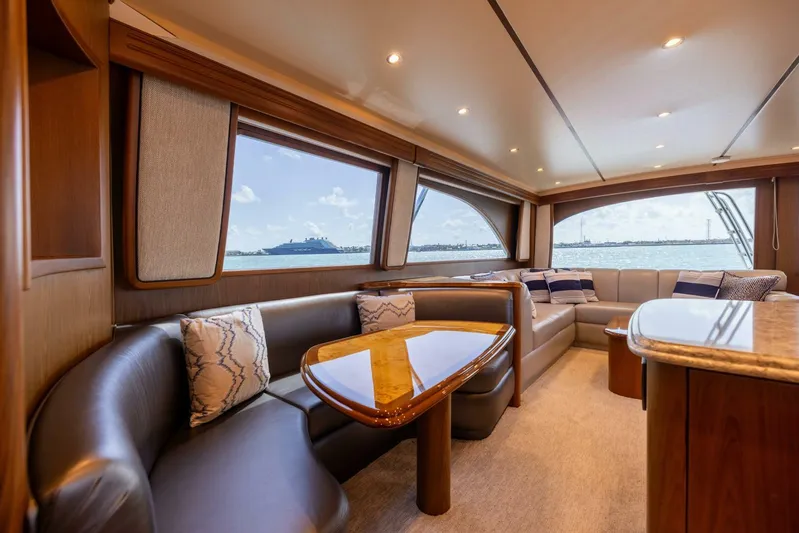 Mighty Mouse Yacht Photos Pics Luxurious interior of 2011 Viking 70 Convertible yacht with elegant seating and ocean view.