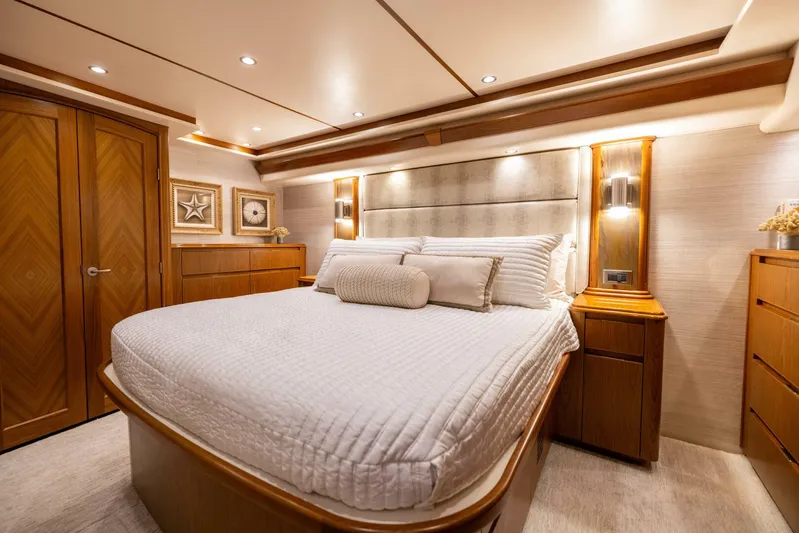 Mighty Mouse Yacht Photos Pics Luxurious bedroom interior of 2011 Viking 70 Convertible yacht with elegant wood finishes.