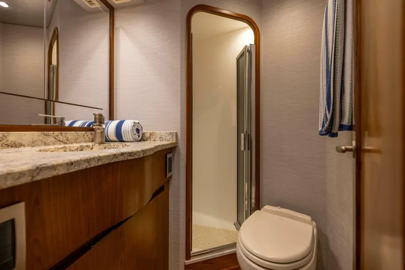 Mighty Mouse Yacht Photos Pics Luxurious bathroom in 2011 Viking 70 Convertible yacht with shower and modern fixtures.