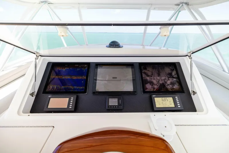 Mighty Mouse Yacht Photos Pics Control panel of a 2011 Viking 70 Convertible yacht with navigation screens.