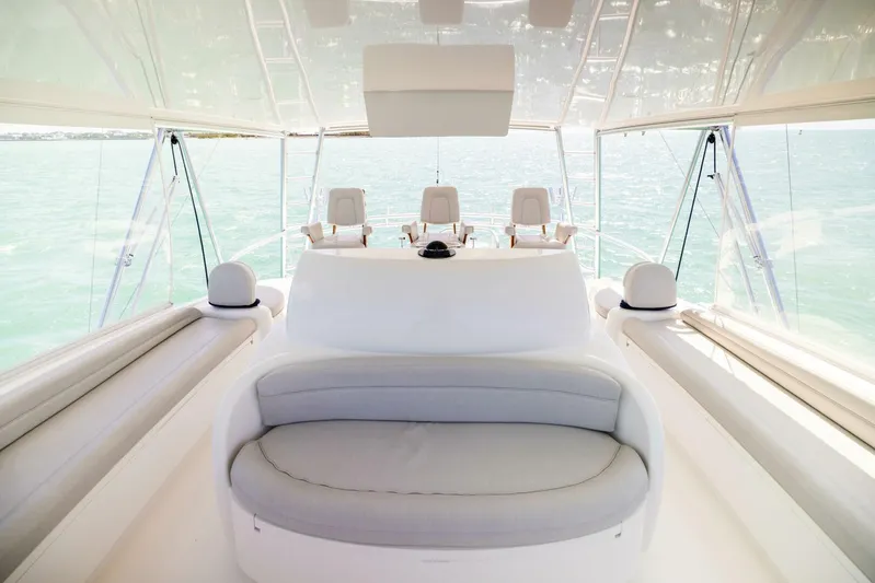 Mighty Mouse Yacht Photos Pics Luxurious interior of 2011 Viking 70 Convertible yacht with plush seating and ocean view.