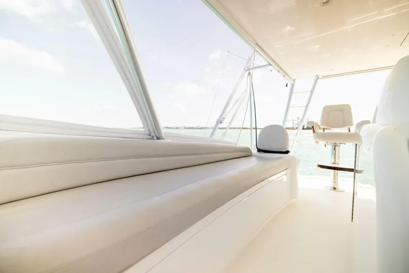 Mighty Mouse Yacht Photos Pics Interior of 2011 Viking 70 Convertible yacht with plush seating and panoramic windows.