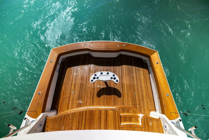 Mighty Mouse Yacht Photos Pics Viking 70 Convertible 2011 yacht deck with teak flooring, overlooking turquoise water.