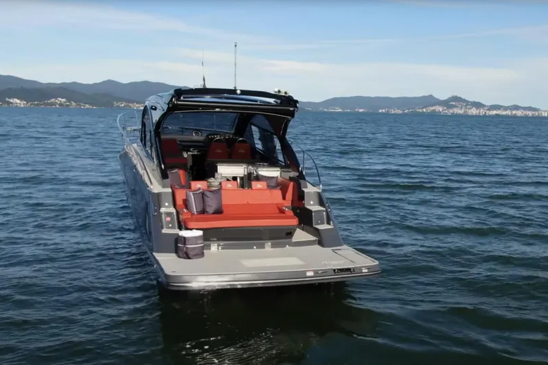  Yacht Photos Pics 2024 Evolve 400HT luxury yacht on open water, featuring sleek design and red seating.