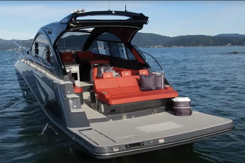  Yacht Photos Pics 2024 Evolve 400HT luxury yacht on water, featuring sleek design and red seating.