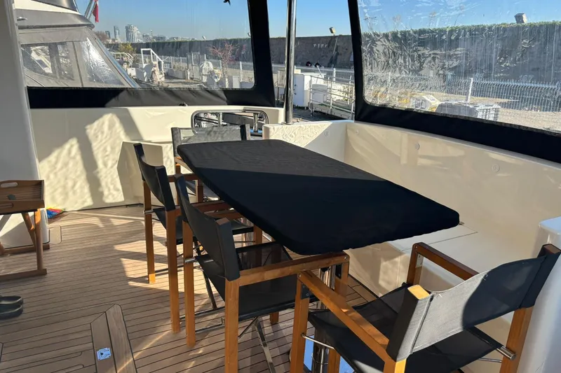  Yacht Photos Pics Luxurious 2025 KRC Yachting KRC57 deck with elegant dining setup.