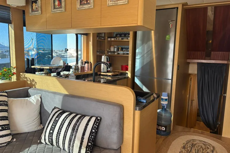  Yacht Photos Pics Luxurious interior of 2025 KRC Yachting KRC57 yacht with modern kitchen and cozy seating area.