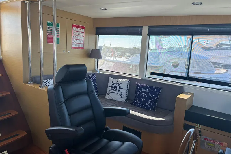  Yacht Photos Pics Luxurious interior of 2025 KRC Yachting KRC57 with plush seating and nautical decor.