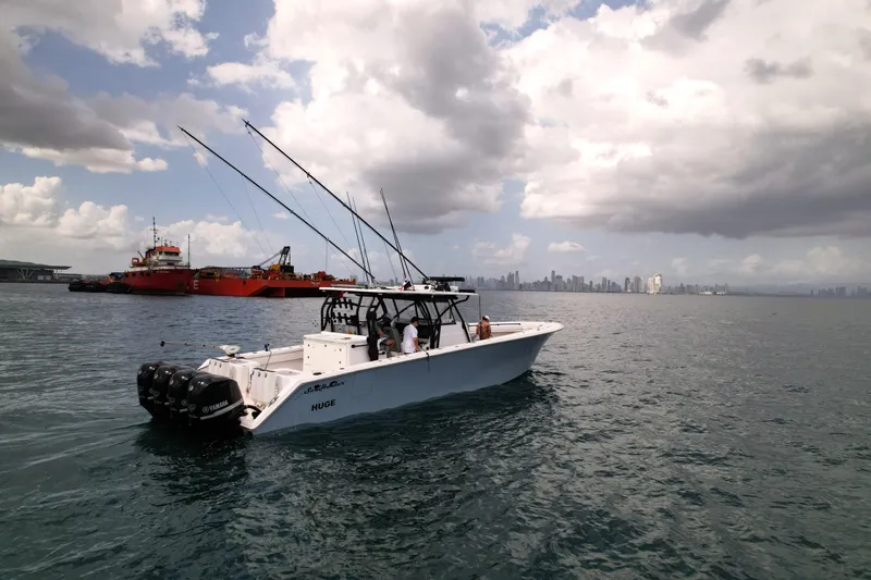  Yacht Photos Pics SeaHunter 45 Tournament boat on water with city skyline in background, 2018 model.