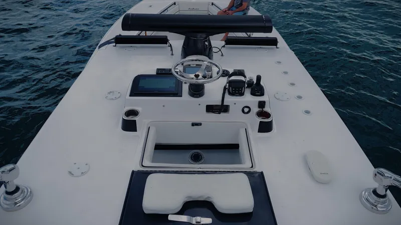  Yacht Photos Pics 2018 SeaHunter 45 Tournament boat dashboard with steering wheel and controls on open water.