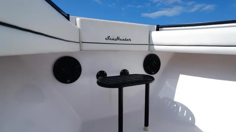  Yacht Photos Pics 2018 SeaHunter 45 Tournament boat interior with speakers and seating under blue sky.