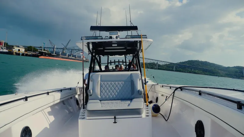  Yacht Photos Pics 2018 SeaHunter 45 Tournament boat cruising on open water near a port.