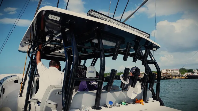  Yacht Photos Pics 2018 SeaHunter 45 Tournament boat with passengers, equipped for fishing, on a sunny day.