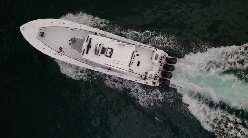  Yacht Photos Pics Aerial view of 2018 SeaHunter 45 Tournament boat speeding on water.